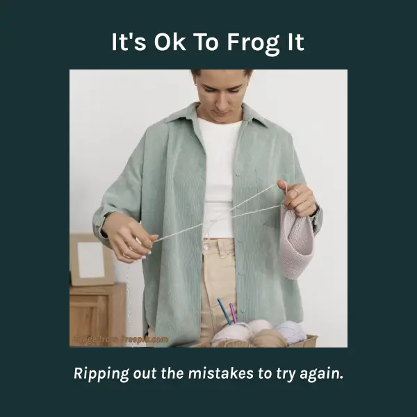 Woman holding a crochet project with strands of yarn pulled loose, symbolizing the idea of frogging or ripping back stitches